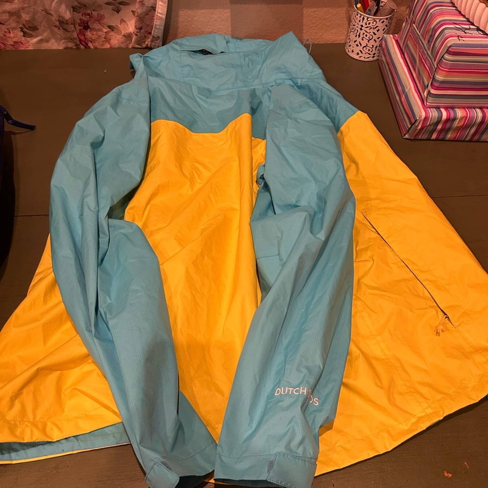 Dutch Bros Vibrant Blue and Yellow Raincoat Lightweight Weather-Resistant